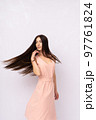 Young woman with long hair. Brunette 97761824