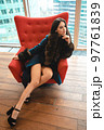 Gorgeous woman in coat standing in modern apartaments 97761839