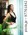 Beautiful confident woman in office 97761842