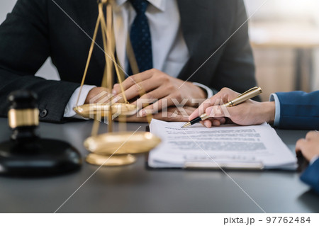 Lawyer singing in documents, filling court records, job responsibilities in office. 97762484