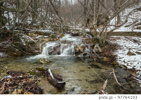 Diferent cascades of Djur-Djur waterfall on Ulu-Uzen river in early spring. Khapkhalskiy canyon in Crimea 97764103