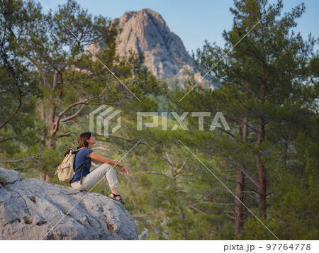 woman traveler walking by Lycian Way trail woman traveler walking by Lycian Way trail 97764778
