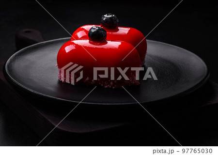 Delicious cheese cakes with red coating made for Valentine's holiday 97765030