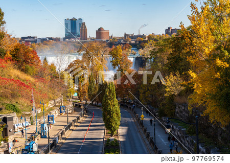 Niagara Falls City, Ontario, Canada - October 27 2022 : Murray Street view at dusk. Falls View area in autumn foliage season. American Falls in the background. 97769574