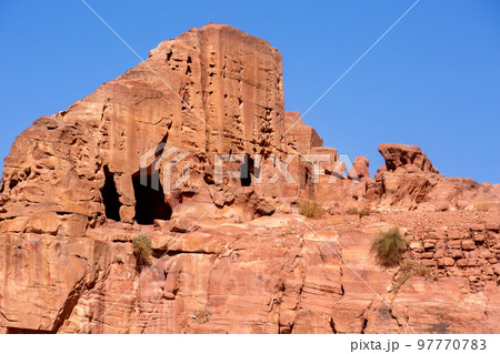 Carved caves in the ancient Petra City, Jordan Carved caves in the ancient Petra City, Jordan 97770783