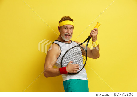Play Tennis. Smiling Man Holding Tennis Rocket. Funny Senior Tennis Player Playing At Rocket Play Tennis. Smiling Man Holding Tennis Rocket. Funny Senior Tennis Player Playing At Rocket 97771800