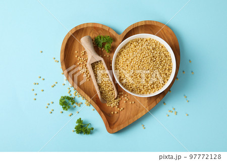 Concept of cooking, uncooked ptitim, top view 97772128