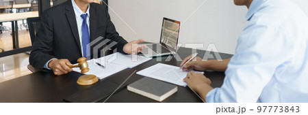 Concept of lawyer counseling, Senior lawyer gives businessman legal advice over a business contract 97773843