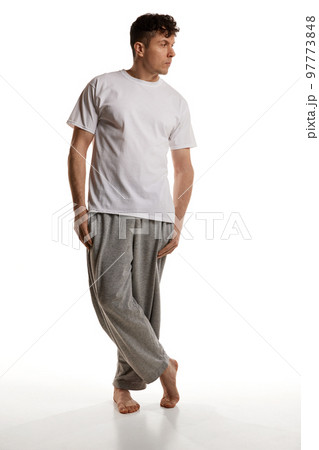 Mature man posing in shirt and pants over white studio background. Comfortable homewear. Casual look. Relaxed. Men's health and beauty 97773848