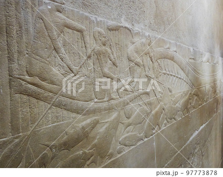 old egypt hieroglyphs carved on the stone 97773878