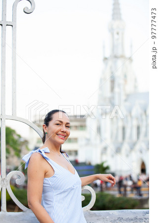 Beautiful tourist woman at the Ortiz Bridge with La Ermita church on background in the city of Cali in Colombia Beautiful tourist woman at the Ortiz Bridge with La Ermita church on background in the city of Cali in Colombia 97777473