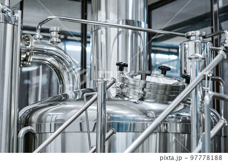 Close-up of big stainless tank for brewing beer in bottling plant 97778188