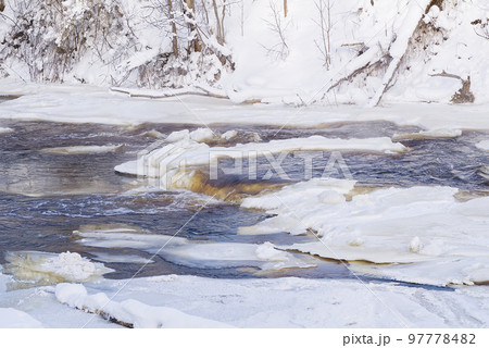 Arctic, Nordic landscape in winter time. Small river with ice in winter time Arctic, Nordic landscape in winter time. Small river with ice in winter time 97778482