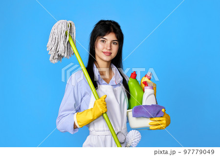woman in gloves holding bucket of detergents and mop woman in gloves holding bucket of detergents and mop 97779049