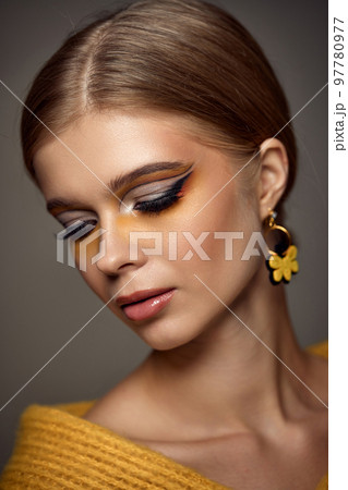 Beauty blonde model girl with fashionable creative make-up Beauty blonde model girl with fashionable creative make-up 97780977