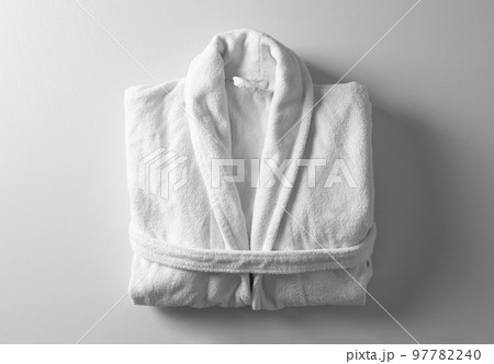 Clean folded bathrobe on white background, top view Clean folded bathrobe on white background, top view 97782240