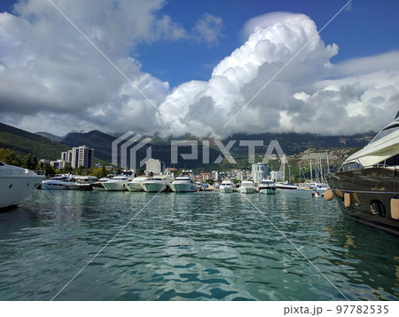 Yacht parking in summer, A marina lot, Yachts and sailboats is moored at quay in Montenegro. 97782535