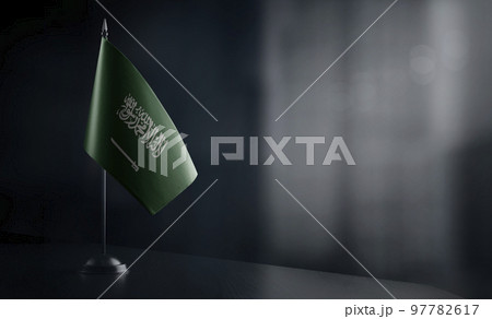 Small national flag of the Saudi Arabia on a black background Small national flag of the Saudi Arabia on a black background 97782617