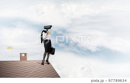 Concept of security and privacy protection with camera headed woman 97789634