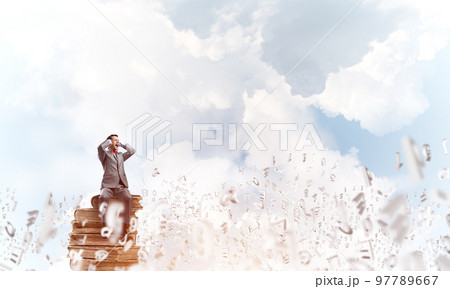 Young man in day sky dont want to hear anything 97789667