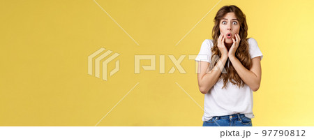 Pity upset worried cute curly-haired girl frowning feel sorry for friend pulling sorrow face touch cheeks gasping distressed express empathy shook stand yellow background anxious terrified Pity upset worried cute curly-haired girl frowning feel sorry for friend pulling sorrow face touch cheeks gasping distressed express empathy shook stand yellow background anxious terrified 97790812