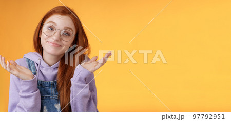Nothing much. Attractive silly unsure carefree redhead unbothered cute female wearing geek glasses smirking uncertain shrugging hands spread sidways clueless what do future, orange background Nothing much. Attractive silly unsure carefree redhead unbothered cute female wearing geek glasses smirking uncertain shrugging hands spread sidways clueless what do future, orange background 97792951
