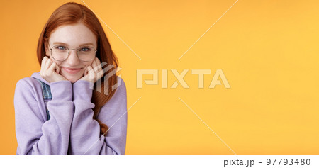 Lovely cute redhead sweet silly girl geek university student wearing glasses lean hand smiling tenderly look affection adore listen sensual confessions boyfriend, standing orange background Lovely cute redhead sweet silly girl geek university student wearing glasses lean hand smiling tenderly look affection adore listen sensual confessions boyfriend, standing orange background 97793480