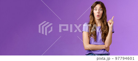 Got it eureka. Excited enthusiastic creative cute european girl raise index finger folding lips wow great found solution suggest perfect plan stand purple background thrilled give good advice 97794601