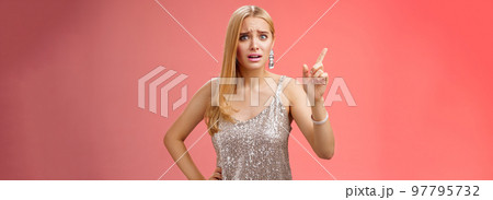 How could you. Disappointed let down upset complaining young woman demanding respect raise index finger scolding teaching lesson give instructions standing bothered displeased, red background How could you. Disappointed let down upset complaining young woman demanding respect raise index finger scolding teaching lesson give instructions standing bothered displeased, red background 97795732