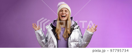 Joyful happy blond woman free emotions yelling happily having fun enjoying awesome astonishing day smiling broadly raising hands up triumphing celebrating win achivement dream come true Joyful happy blond woman free emotions yelling happily having fun enjoying awesome astonishing day smiling broadly raising hands up triumphing celebrating win achivement dream come true 97795734