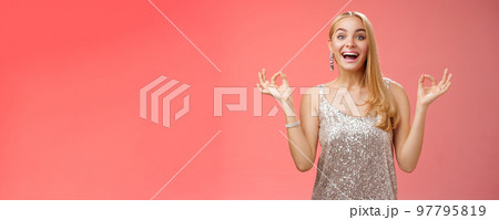 Excited carefree happy stress-free charming blond european woman calm feelings under control show zen gesture standing nirvana lotus pose meditating joyfully smiling, calmd-down red background Excited carefree happy stress-free charming blond european woman calm feelings under control show zen gesture standing nirvana lotus pose meditating joyfully smiling, calmd-down red background 97795819