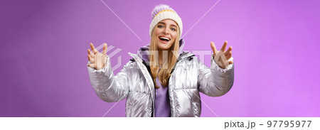 Charming carefree gorgeous blond european girl holding big thing explaining shape box extend arms reaching camera wanna hold friend tight cuddle embrace smiling friendly satisfied, purple background Charming carefree gorgeous blond european girl holding big thing explaining shape box extend arms reaching camera wanna hold friend tight cuddle embrace smiling friendly satisfied, purple background 97795977