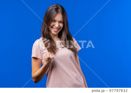 Pretty teen girl shows triumph yes gesture of victory, she achieved result, goals. Woman glad, happy Pretty teen girl shows triumph yes gesture of victory, she achieved result, goals. Woman glad, happy 97797632