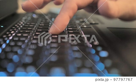 Finger pressing an enter key. Computer user hitting the enter key, up close. Confirmation, sending a message Finger pressing an enter key. Computer user hitting the enter key, up close. Confirmation, sending a message 97797767
