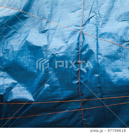 Blue crumpled synthetic fabric. 97798618