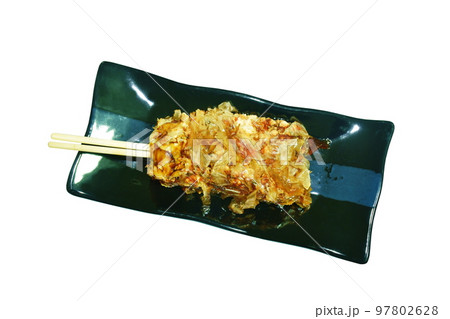 Okonomiyaki or Japanese pizza grilled roll in wooden stick topping mashed salmon and seaweed dressing mayonnaise roll on plate Okonomiyaki or Japanese pizza grilled roll in wooden stick topping mashed salmon and seaweed dressing mayonnaise roll on plate 97802628