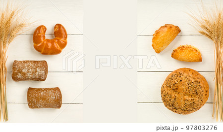 Bread , sweet pastry and ears of wheat on white background. View from above. Free space for text. Bread , sweet pastry and ears of wheat on white background. View from above. Free space for text. 97803276