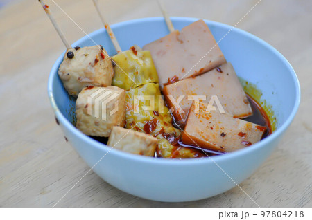 grilled tofu, wonton or Chinese dumpling or dumpling and sausage or Chinese food or Chinese soup grilled tofu, wonton or Chinese dumpling or dumpling and sausage or Chinese food or Chinese soup 97804218