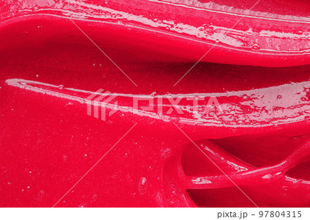 Color of the year 2023 Viva magenta. Pink gel texture. Cosmetic clear liquid cream smudge. Skin care product sample closeup. Toothpaste or wax 97804315