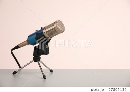 Microphone on light grey table, space for text. Journalist's work Microphone on light grey table, space for text. Journalist's work 97805132