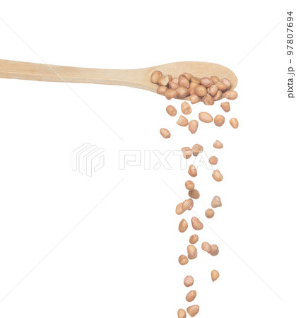 Peanut fall, brown grain peanuts explode abstract cloud fly from wooden spoon. Beautiful complete seed pea peanuts, food object design. Selective focus freeze shot white background isolated Peanut fall, brown grain peanuts explode abstract cloud fly from wooden spoon. Beautiful complete seed pea peanuts, food object design. Selective focus freeze shot white background isolated 97807694