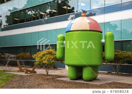 San Francisco, USA. September 20, 2022. Large statue of Android Noogler with propeller cap in front of modern glass office building at Google campus 97808028