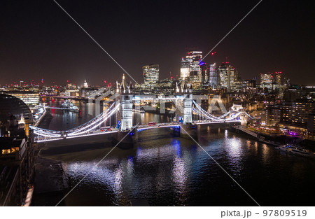 London Tower Bridge and City of London by night - amazing aerial view London Tower Bridge and City of London by night - amazing aerial view 97809519