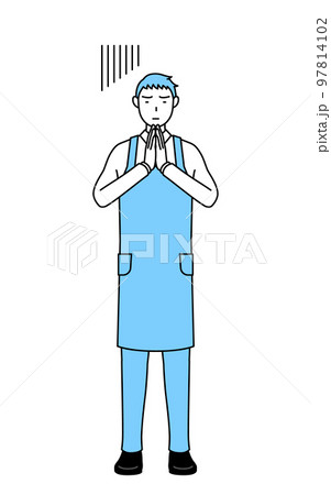 体の前で手を合わせて謝るエプロンを着た男性 97814102