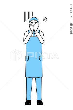 落ち込んで顔を覆うエプロンを着た男性 97814103