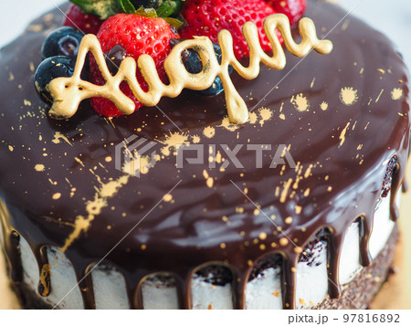 dark chocolate frosted drip cake with best wishes topping written in italian dark chocolate frosted drip cake with best wishes topping written in italian 97816892