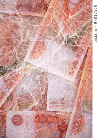 Five thousand rubles are thawed in ice. The Russian currency is frozen. 97817550