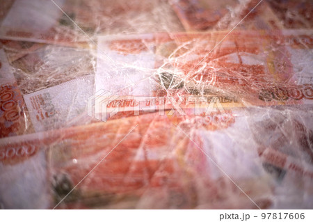 Five thousand rubles are thawed in ice. The Russian currency is frozen. 97817606