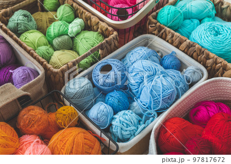 Many baskets made of natural eco-friendly materials. Multicolor yarn for knitting, knitting needles Many baskets made of natural eco-friendly materials. Multicolor yarn for knitting, knitting needles 97817672