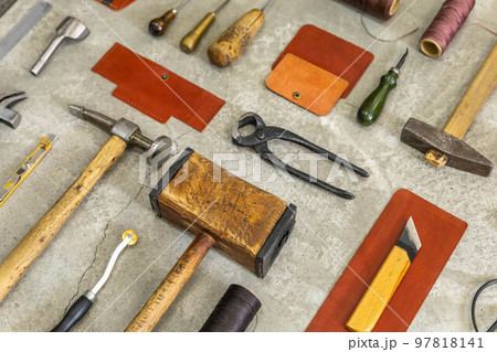 Top view materials and instruments on cutting mat for chopping measurement leatherwork details 97818141